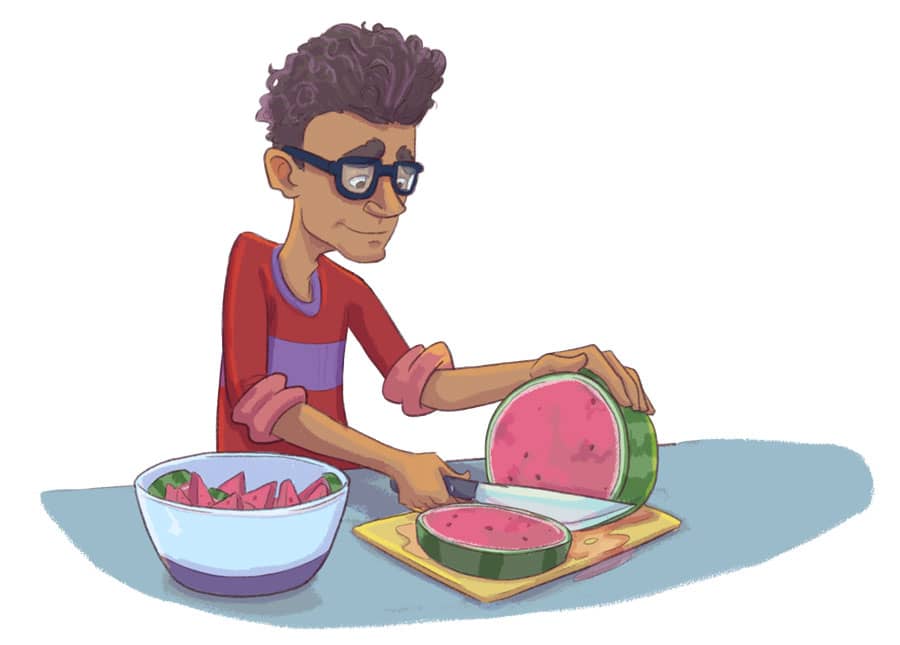 man chopping watermelon on cutting board